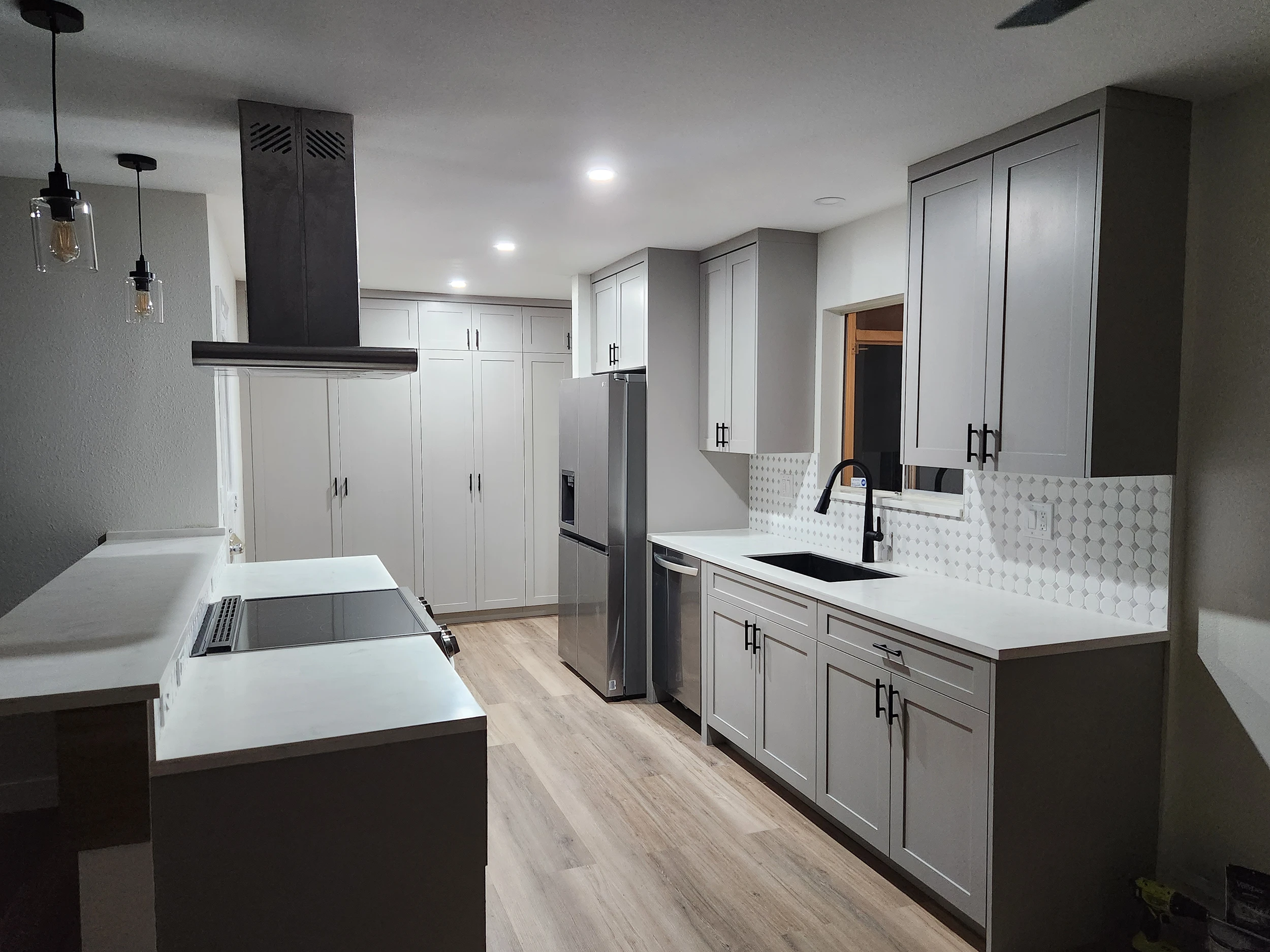 Custom kitchen cabinetry installation showcasing detailed woodwork