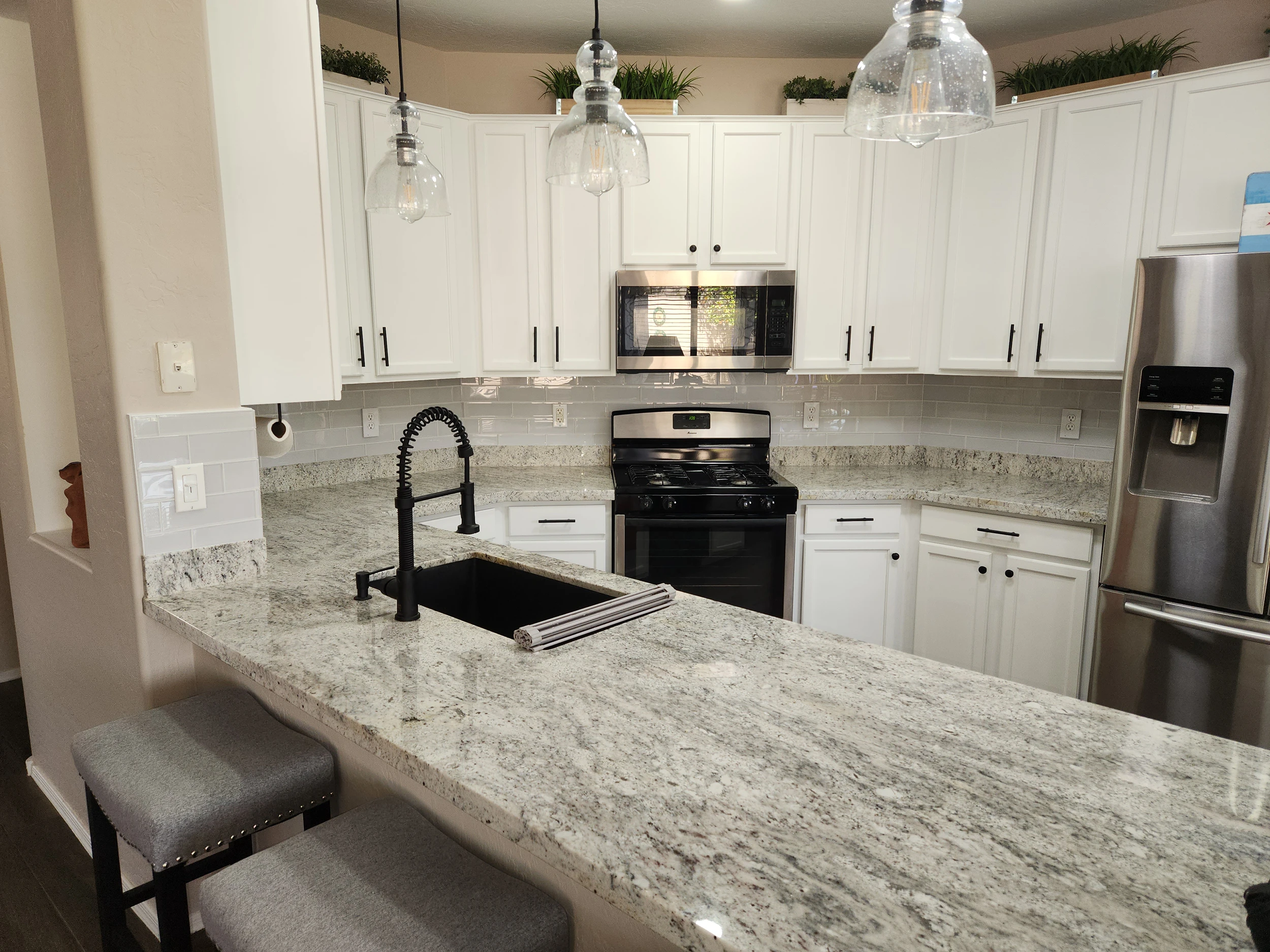 Beautiful custom kitchen featuring Craft Tech Woodworks cabinetry
